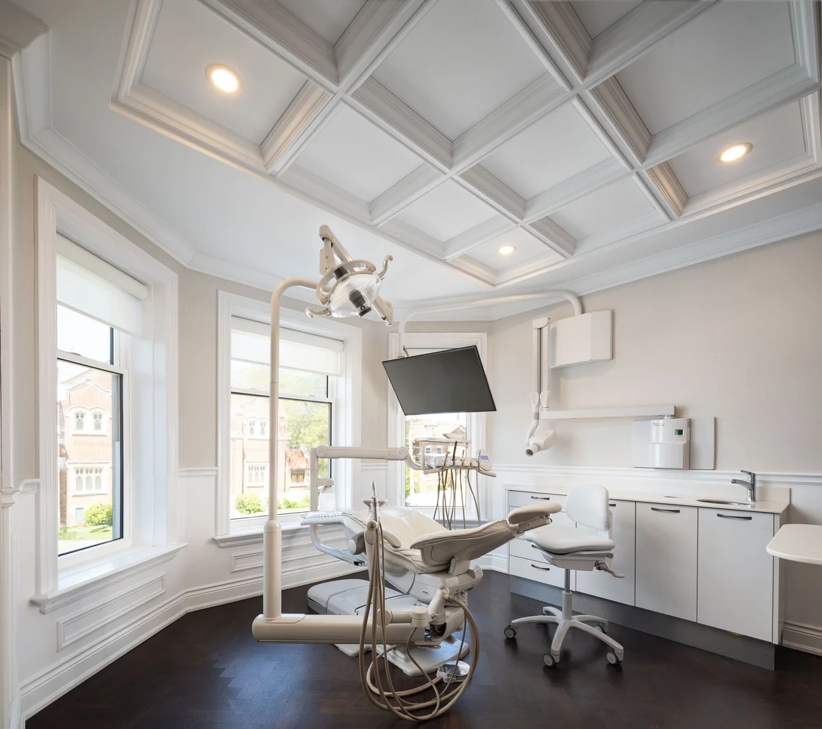 Century Stone Dental at 684 Main Street East, Hamilton: character home interior with coffered ceilings and modern dental technology.