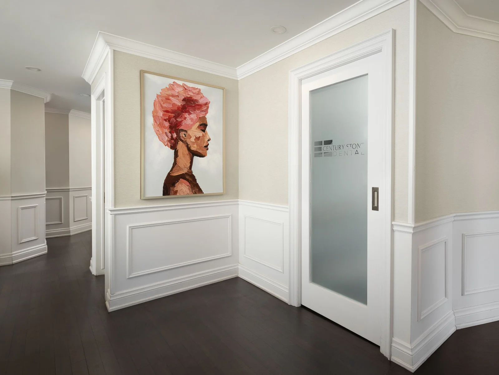 Century Stone Dental, Hamilton: hallway portrait art.