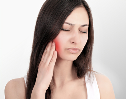 Uncomfortable woman touching cheek with sore wisdom tooth in wisdom teeth removal hamilton