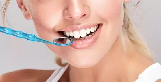 woman having a treatment in dental implant hamilton