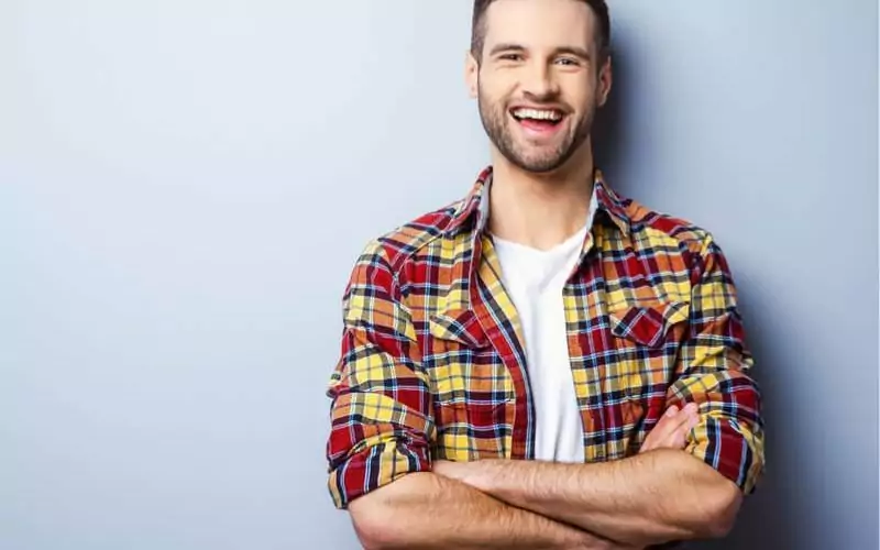 man smiling at dental office in hamilton